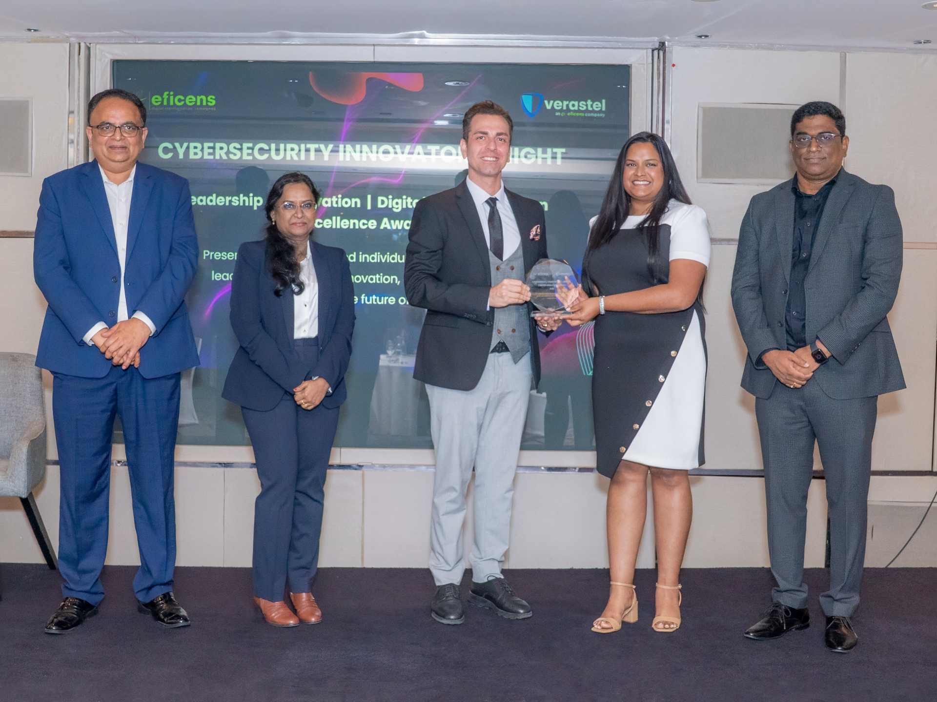 Alec Asgari receiving the Best Web Design Company 2026 award at Cybersecurity Innovators Night