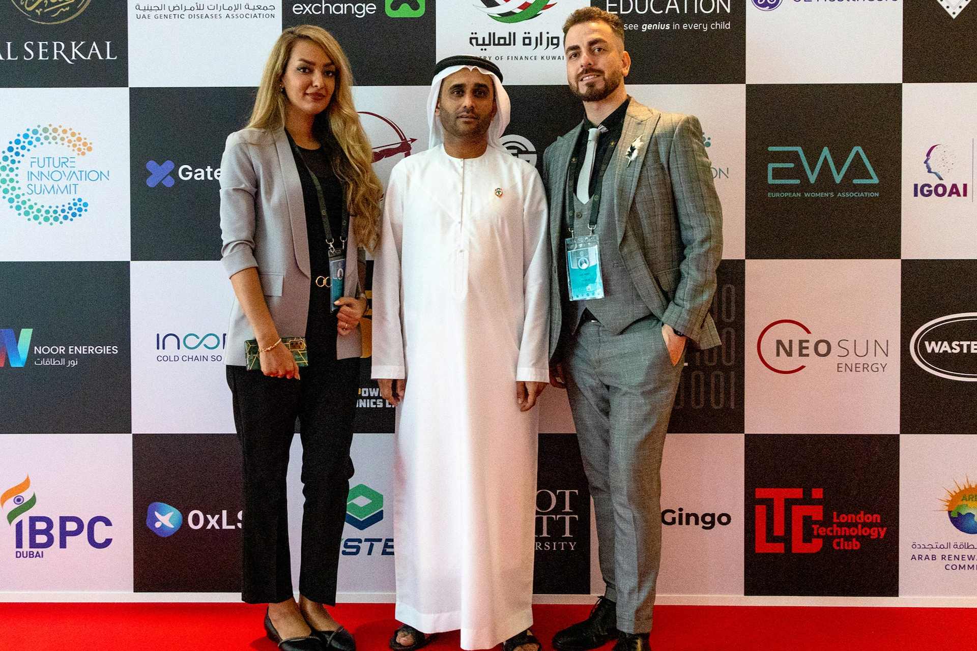 Organizers and partners at the DFISX 2025 Future Innovation Summit sponsor backdrop in Dubai